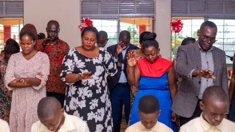 Parents praying for candidates