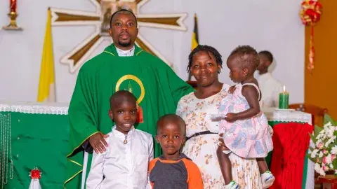 Family picture with priest