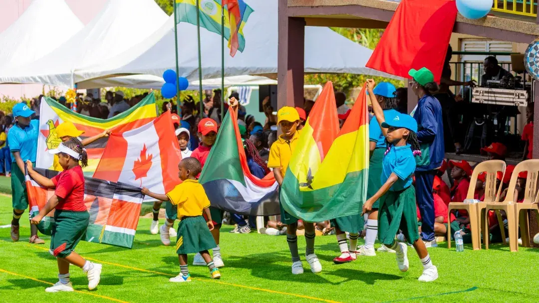 Internal pupils waving flags